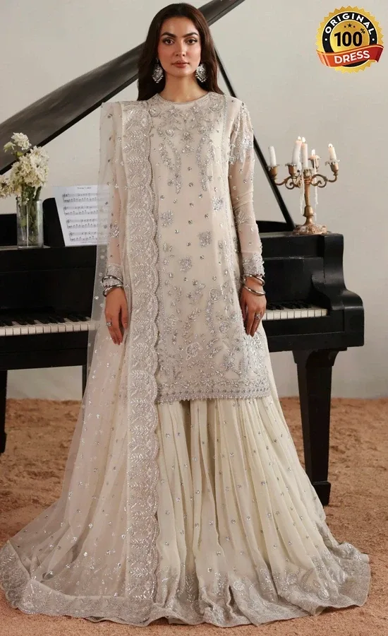 Pakistani White Gharara Suit For Wedding Guests Pakistani white gharara suit for wedding guests with embroidered chiffon and elegant traditional finishing