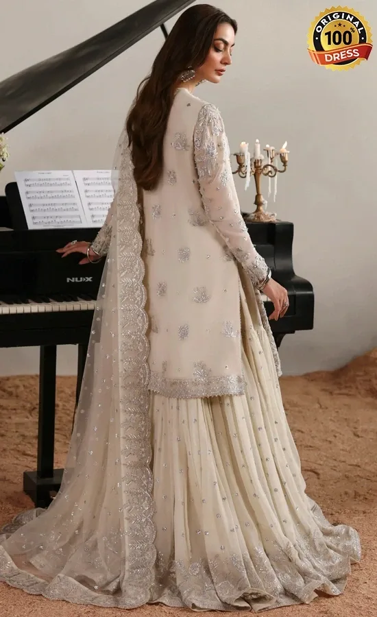 White chiffon gharara suit with embroidered panels, sleeves and graceful formal styling