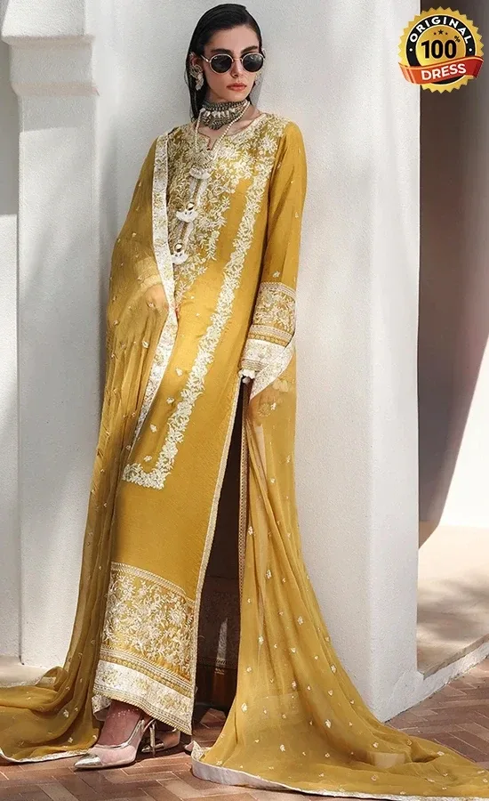 Embroidered mustard yellow salwar kameez for wedding guests with threadwork, patchwork and crystal tassels