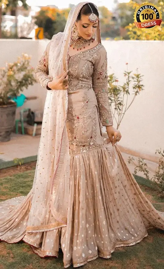 Light brown Nikkah bridal gharara with embellished shirt, wide-leg gharara and organza dupatta