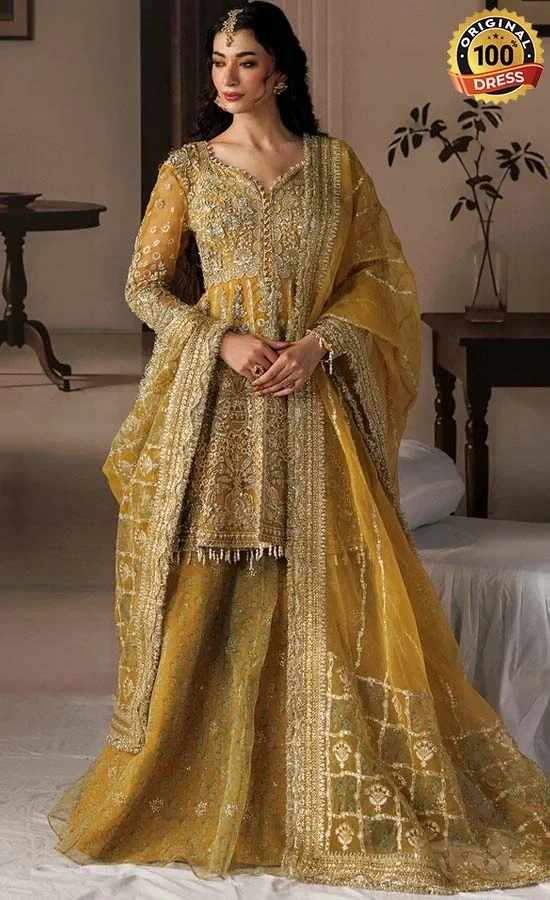 Yellow cotton satin lehenga choli with hand embellished panels and embroidered sleeves