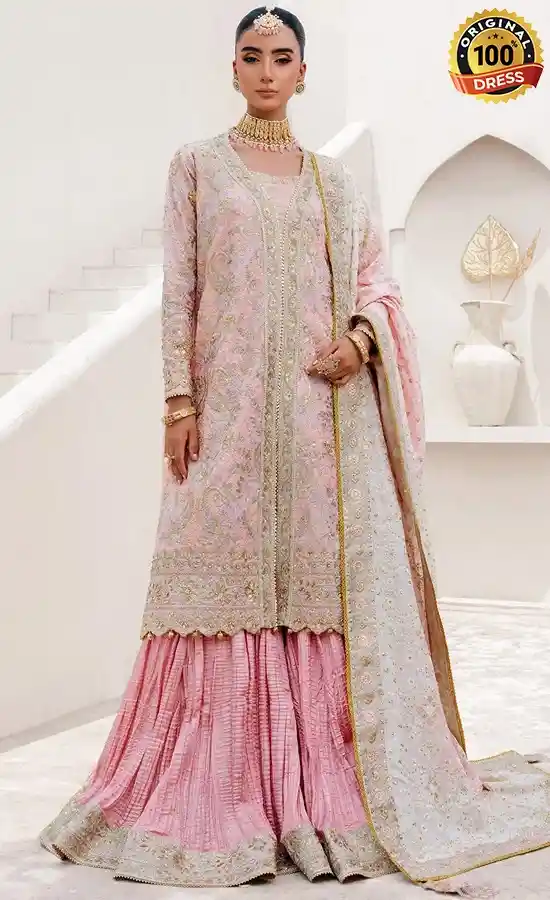 Elegant dusty pink wedding guest suit with traditional salwar kameez styling and hand embroidery
