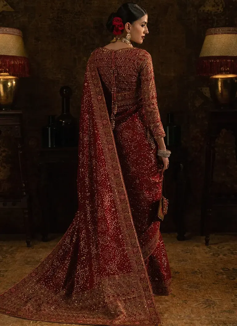 Maroon embroidered medium silk saree with matching blouse, decorative patchwork and organza neckline finishing