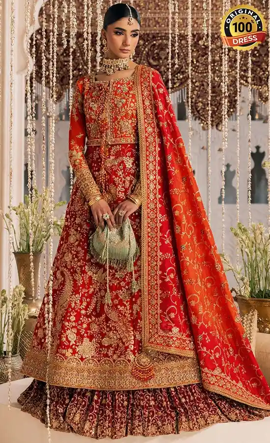 Orange Kataan silk gown with hand embroidery, tassels and samosa lace detailing