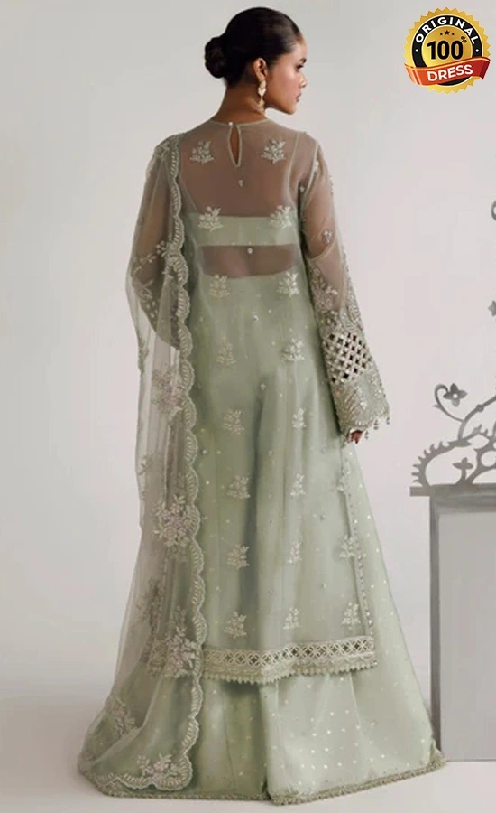 Embroidered sage green plazzo suit for wedding guests with graceful traditional styling