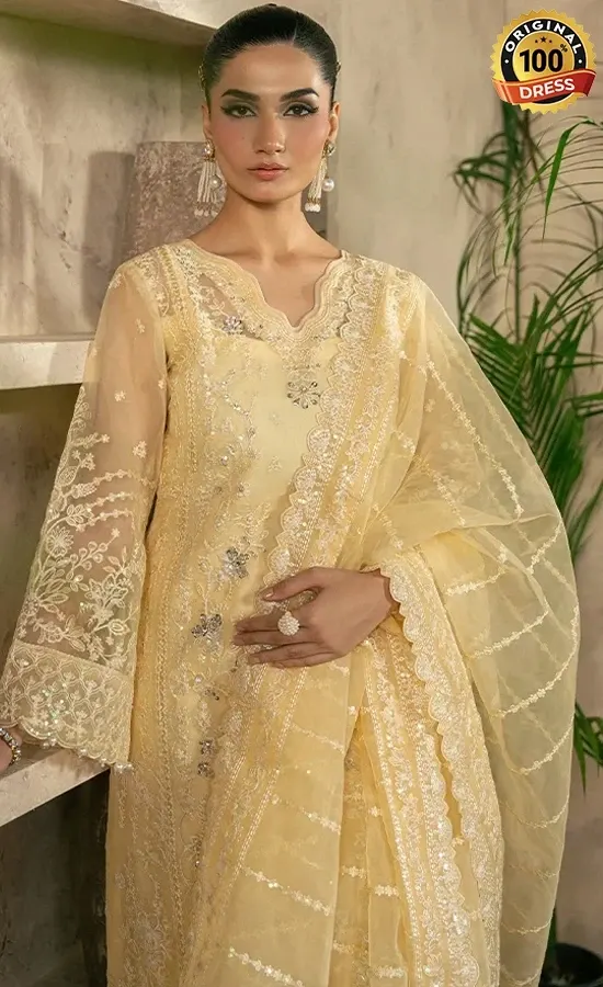 Embroidered pastel yellow salwar kameez for wedding guests with sequined organza detailing