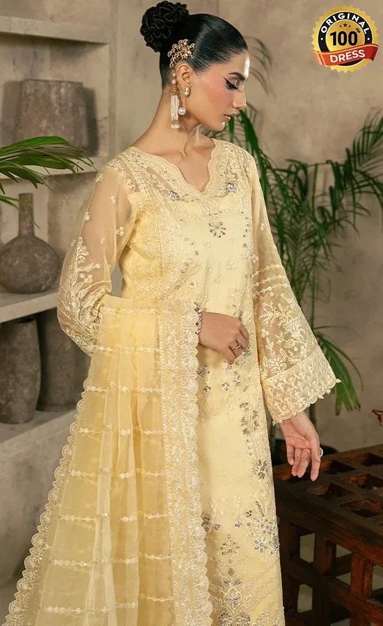 Pastel yellow salwar kameez for wedding guests with elegant embroidery and organza detailing