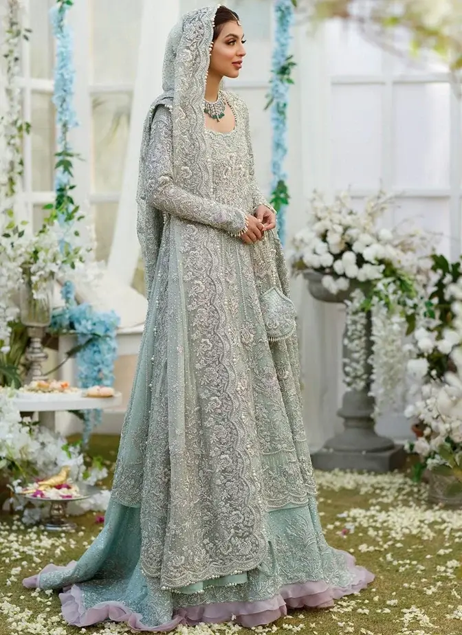 Pakistani aqua bridal frock with lehenga featuring silver detailing, tassels and graceful Nikkah styling