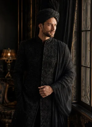 Black groom sherwani styled with matching turban and black shawl