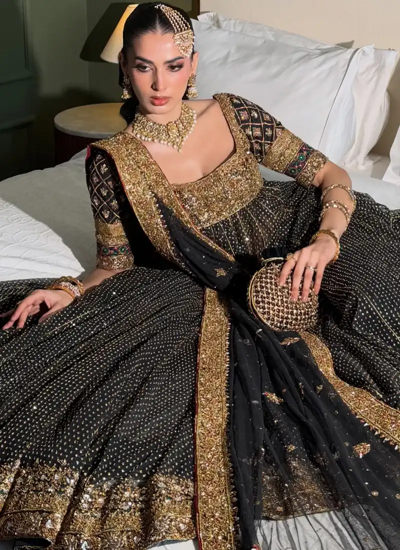 Black and gold embellished bridal Pishwas with traditional Kalidar silhouette and colourful sleeve detailing