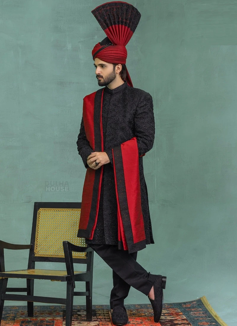Black sherwani with red shawl and matching turban for groom wedding wear