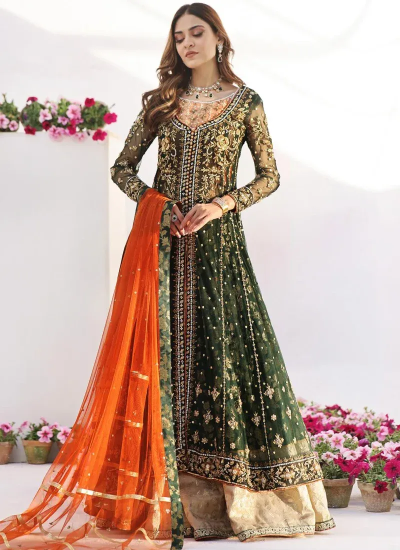 Bottle green Pakistani formal open gown with burnt orange dupatta and Dhaka pajama