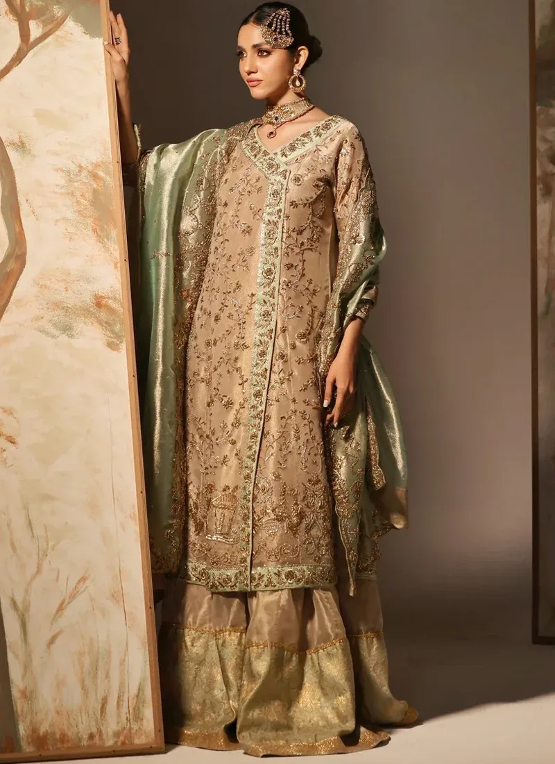 Champagne gold Pakistani bridal Angrakha with flapper trousers and mint green dupatta