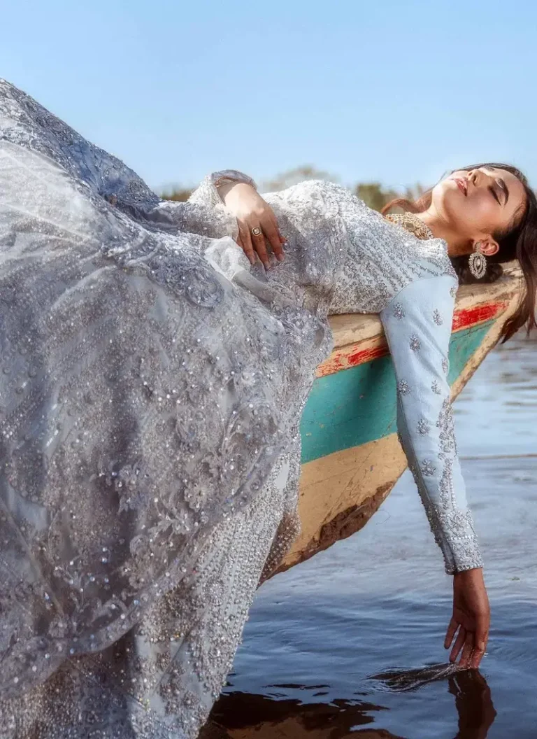Pale blue floor-length bridal gown with attached cancan, silk lining and a long matching organza dupatta.
