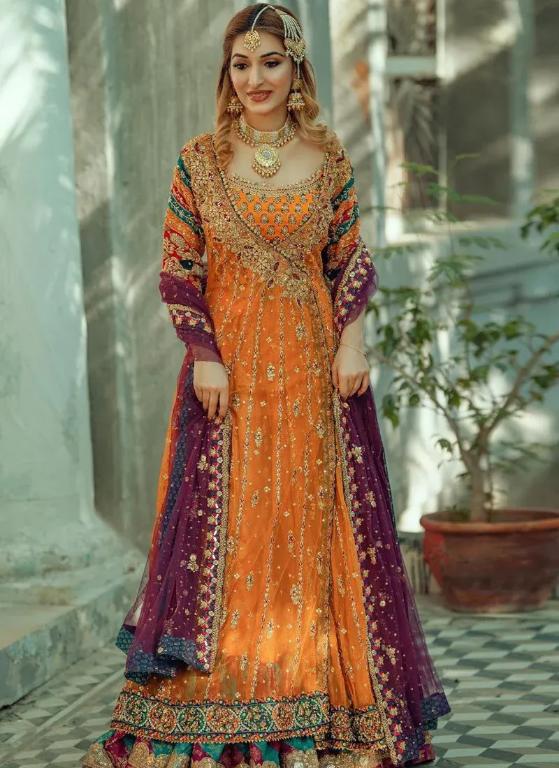 Embroidered mustard orange bridal Angrakha with multicolour detailing for a traditional Mehndi look