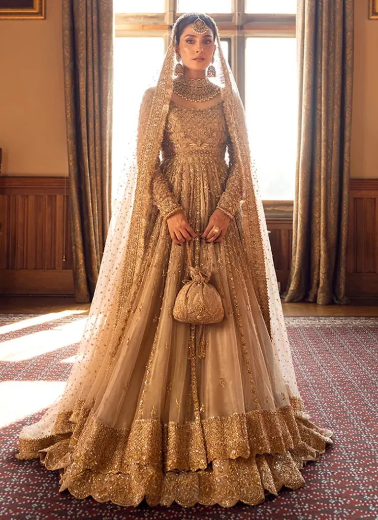 Golden net bridal pishwas dress with pure hand embroidery and traditional embellishments