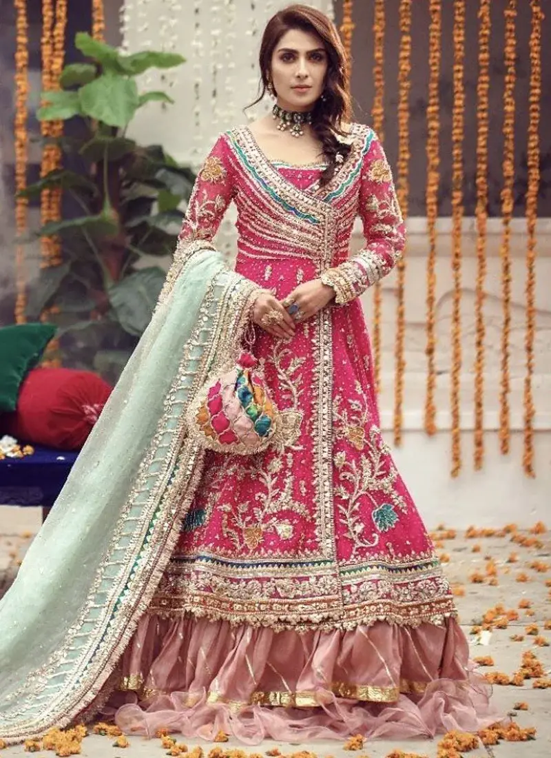 Pakistani bridal Angrakha in shocking pink with mint dupatta and graceful ruffled lehenga
