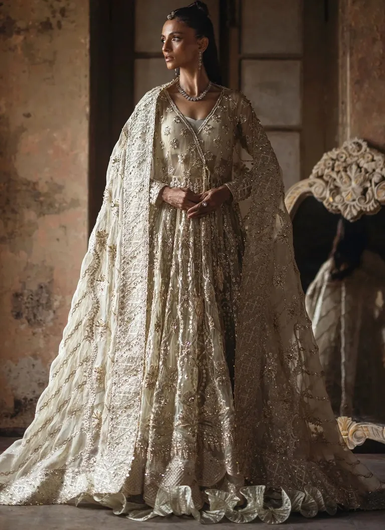 Pakistani butter yellow Angrakha dress for brides with traditional embroidery and graceful wedding styling