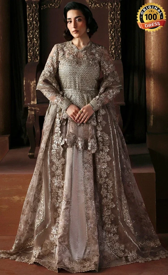 Pakistani champagne lehenga for wedding guests with intricate embroidery and graceful formal styling