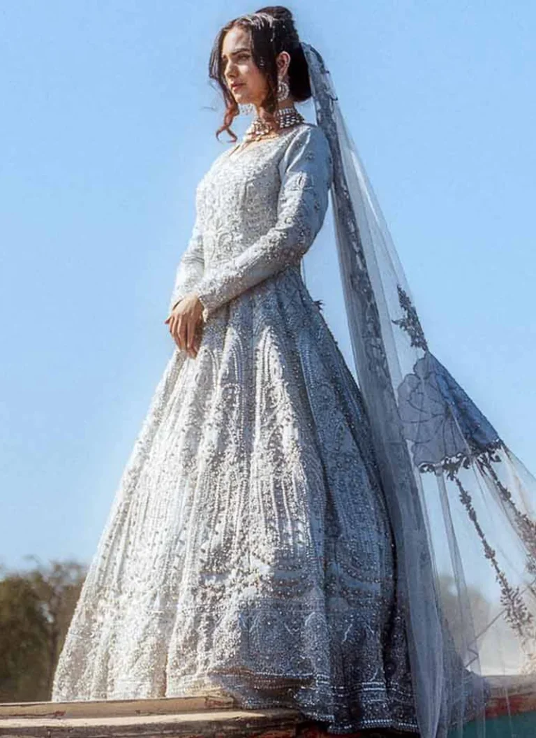 Ali Xeeshan-inspired ice blue bridal gown with V neckline, full sleeves, belted waist and 14-kali skirt.