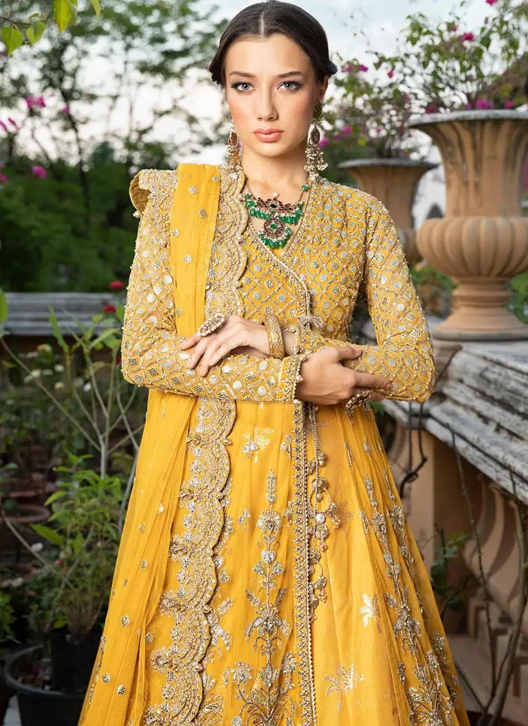 Pakistani mustard Angrakha bridal dress for Mehndi ceremony with traditional embroidery