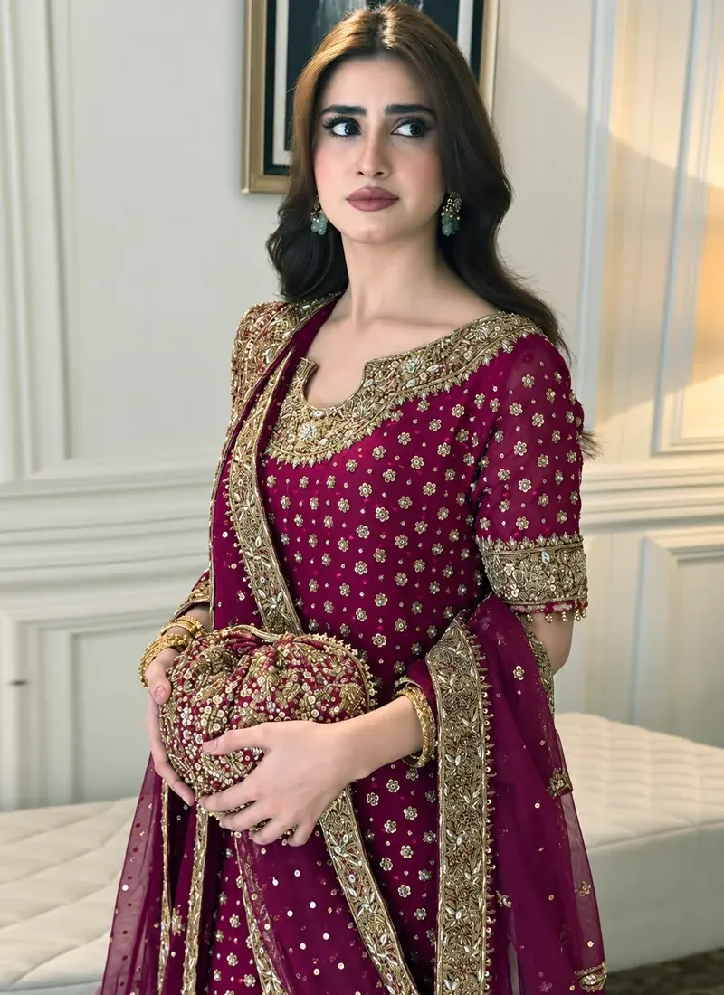 Plum purple embroidered wedding guest dress with gold zardozi work and graceful formal styling