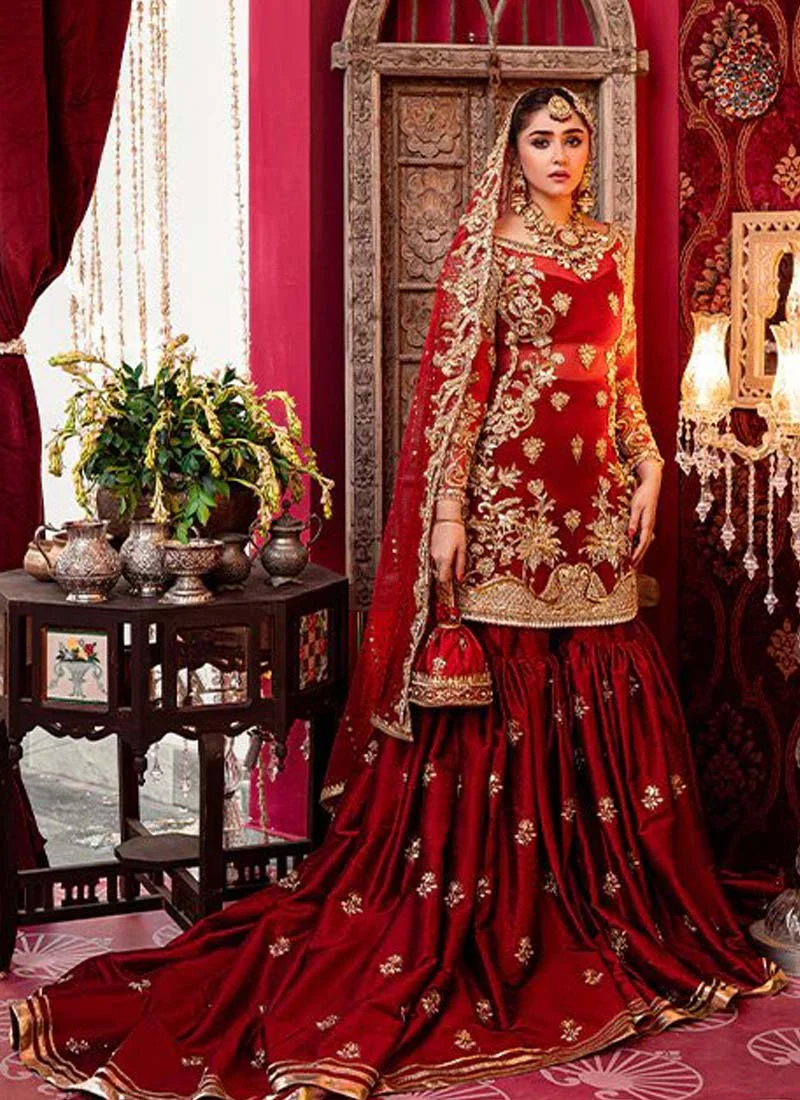Red Farshi gharara bridal outfit with long trail, attached cancan and scalloped embroidered kameez hem