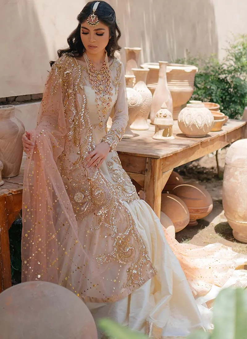 White Nikkah gharara ensemble with pink organza dupatta and gold, rose-gold and silver embroidery