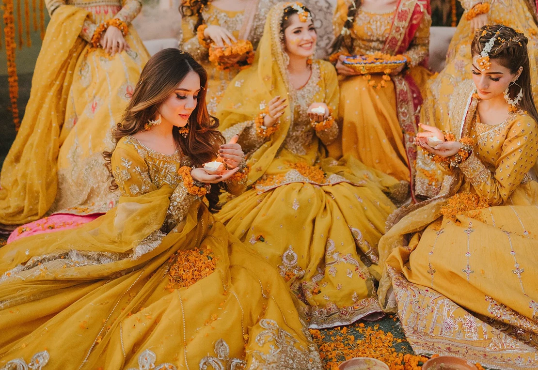 Yellow Mehndi dress for bride with hand embellished net, raw silk sharara and embroidered organza dupatta
