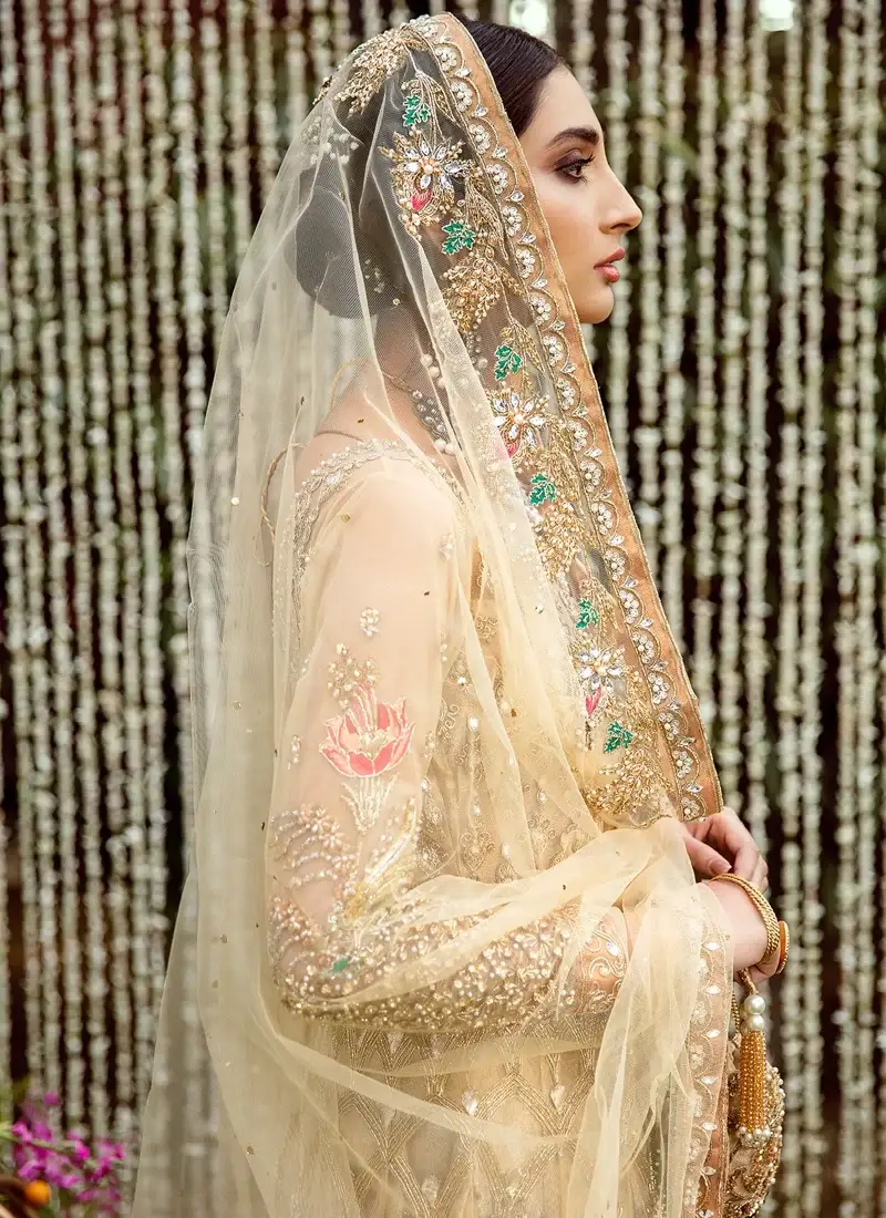 Champagne gold bridal pishwas full front view with embroidered garland swags and floral hem