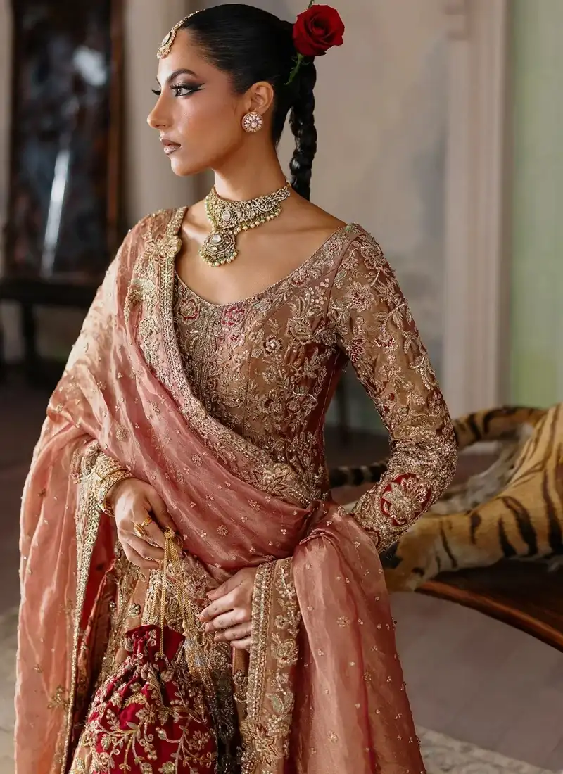 Coral bridal peshwas over deep red farshi lehenga, full rear view with sweeping embroidered border