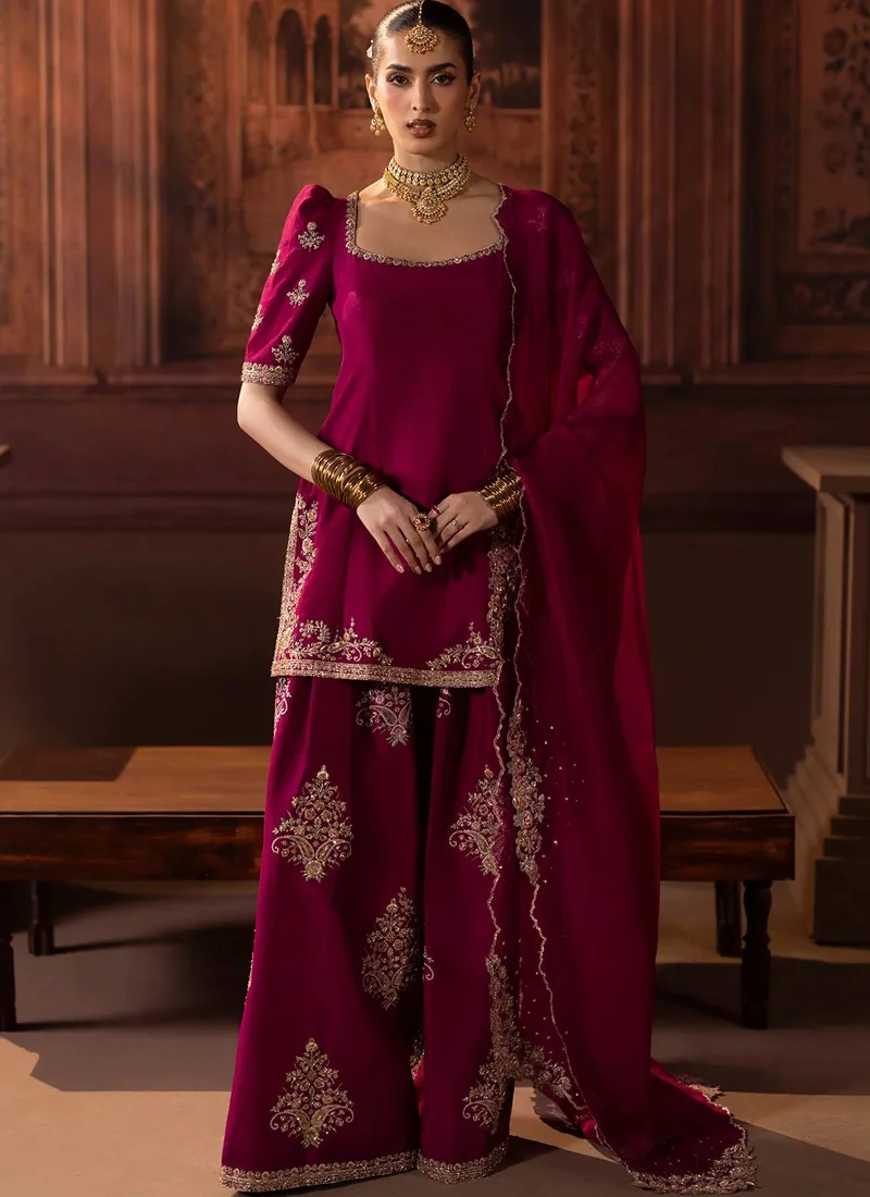 Fuchsia Baraat Farshi Gharara with Dori-Tied Open Back Deep fuchsia farshi gharara with sheer head-draped dupatta and scalloped metallic edging