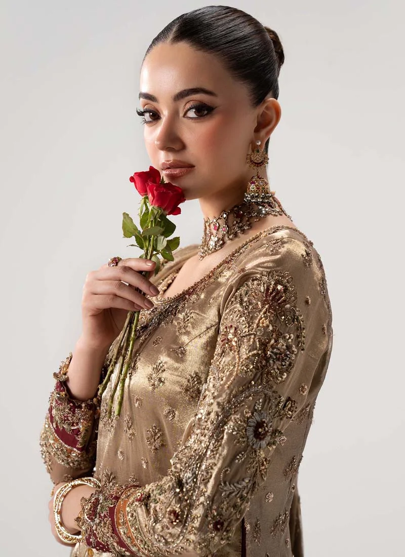 Antique gold gharara suit angled view showing embroidered sleeves and multicoloured jamawar gharara panels