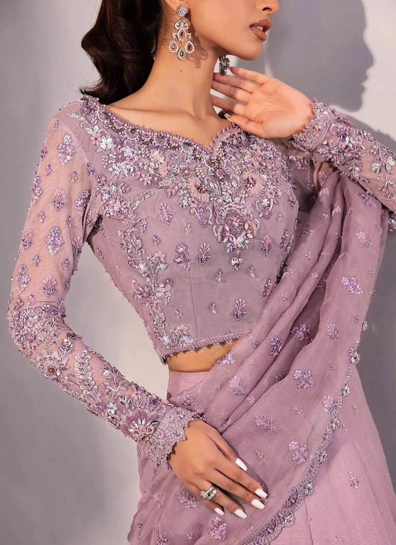 Lilac lehenga saree angled upper view showing sheer floral sleeves and an embroidered drape border
