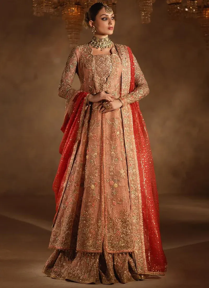 Peach Walima Open Gown with Lehenga with Scalloped Floral Lapels Peach bridal open gown over lehenga, front view with scalloped floral neckline and coral dupatta.