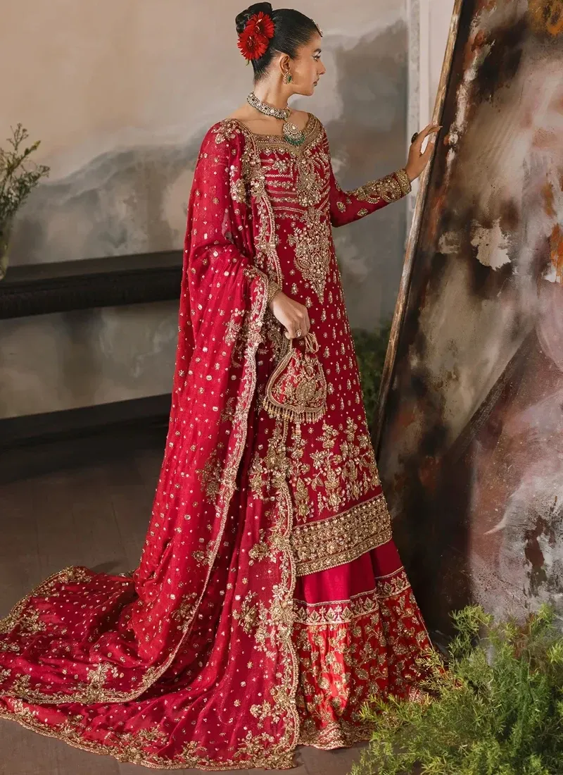 Red bridal long shirt and lehenga front view with gold floral hem and scalloped dupatta border